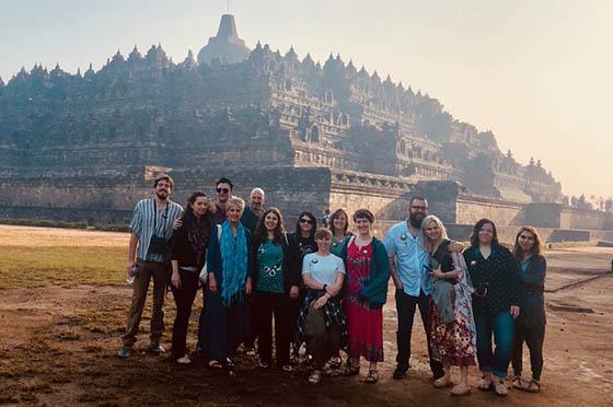 Photo of a group of Chatham University students posing in front of a building in Indonesia